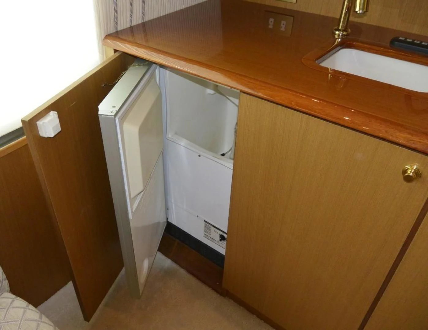 a bathroom with a sink and a cabinet aboard DOG HOUSE Yacht for Sale