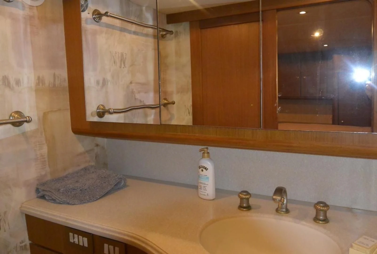 a bathroom with a large mirror aboard DOG HOUSE Yacht for Sale