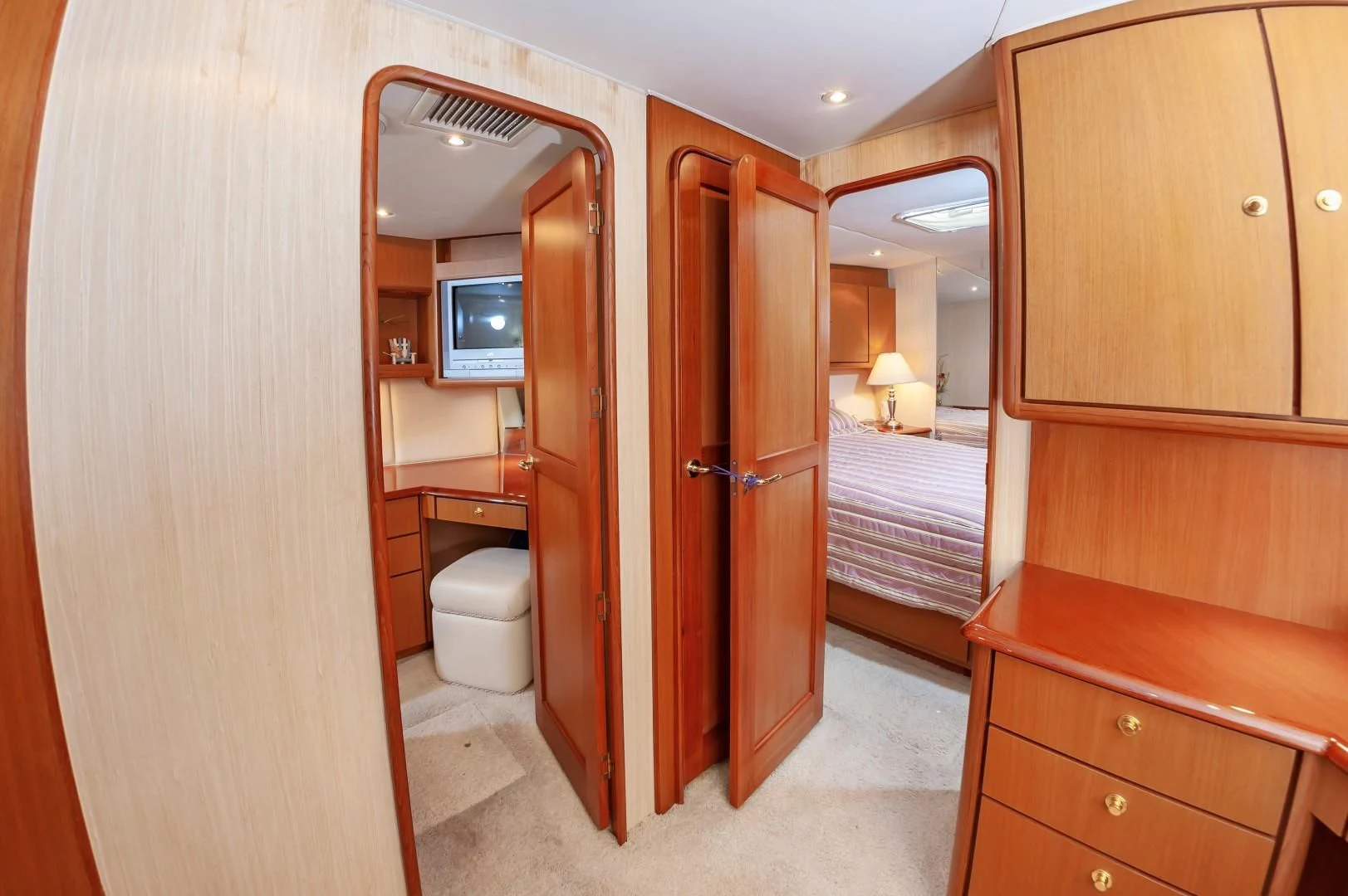a bathroom with a wood door aboard DOG HOUSE Yacht for Sale
