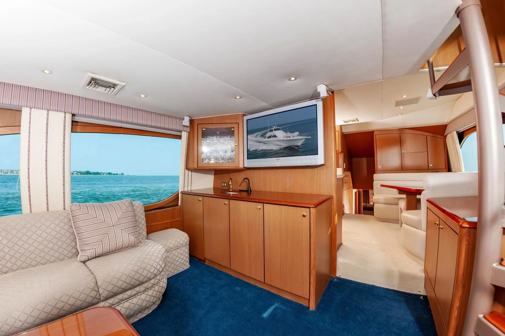 a room with a bed and a television aboard DOG HOUSE Yacht for Sale