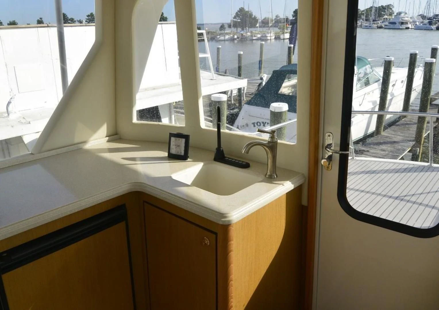 a window with a sink and a mirror aboard DOG HOUSE Yacht for Sale