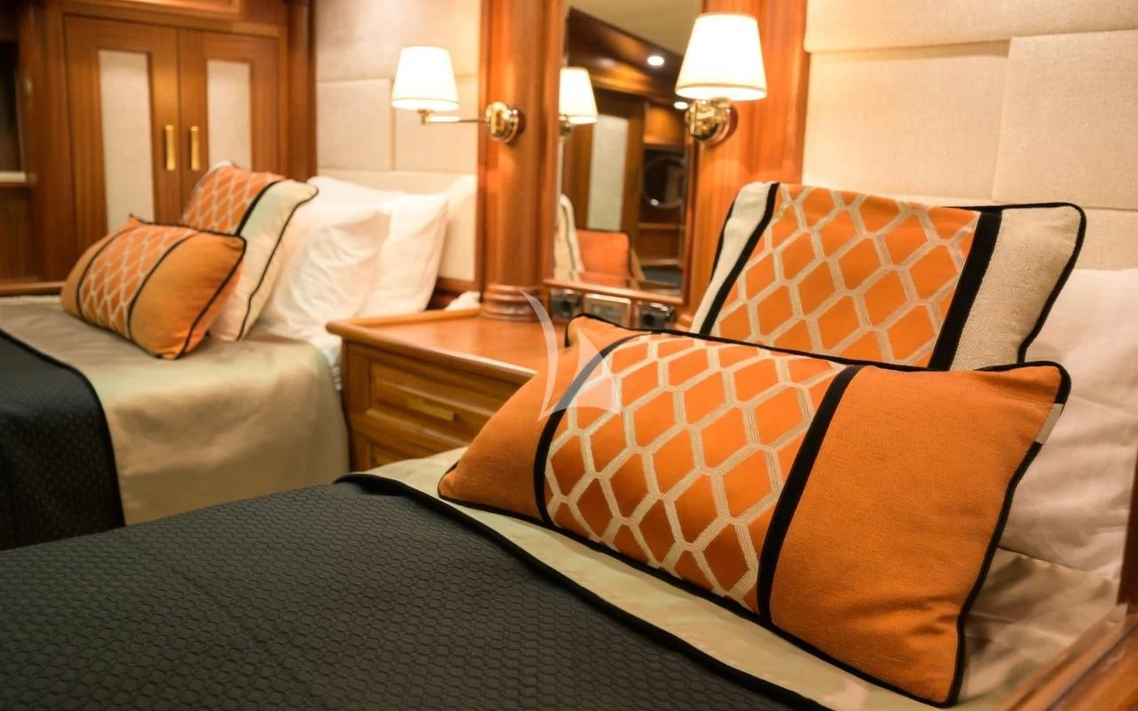 a bed with pillows aboard KAPTAN KADIR Yacht for Sale