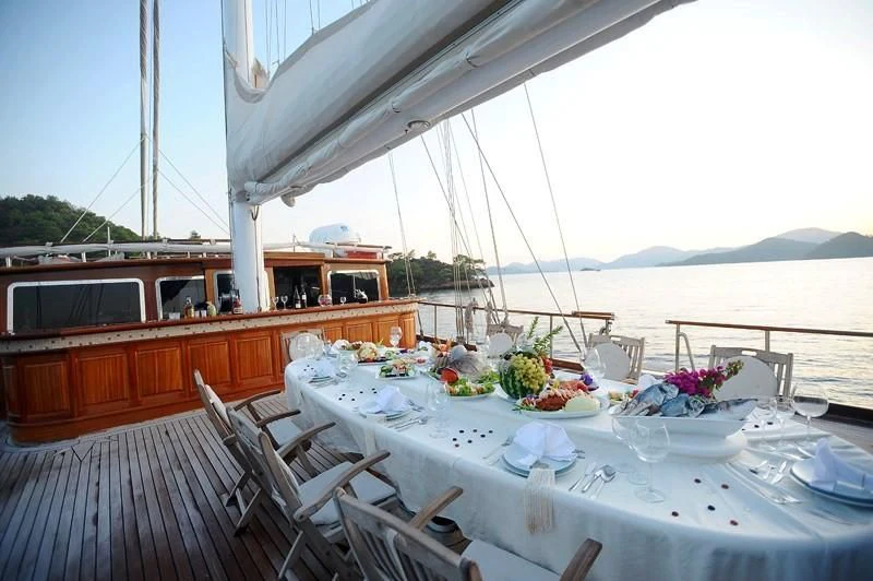a table set for a meal on a boat aboard KAPTAN KADIR Yacht for Sale