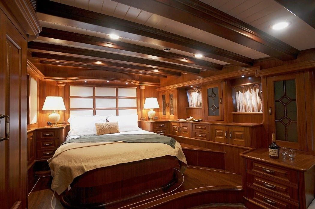 a bedroom with a large bed aboard KAPTAN KADIR Yacht for Sale