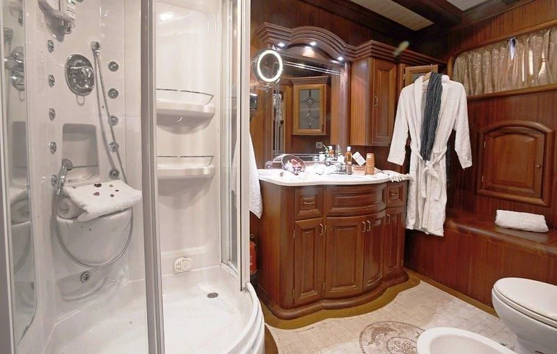 a bathroom with a shower and sink aboard KAPTAN KADIR Yacht for Sale