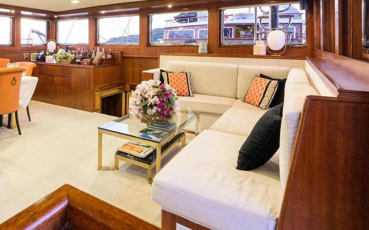a living room with a couch and coffee table aboard KAPTAN KADIR Yacht for Sale