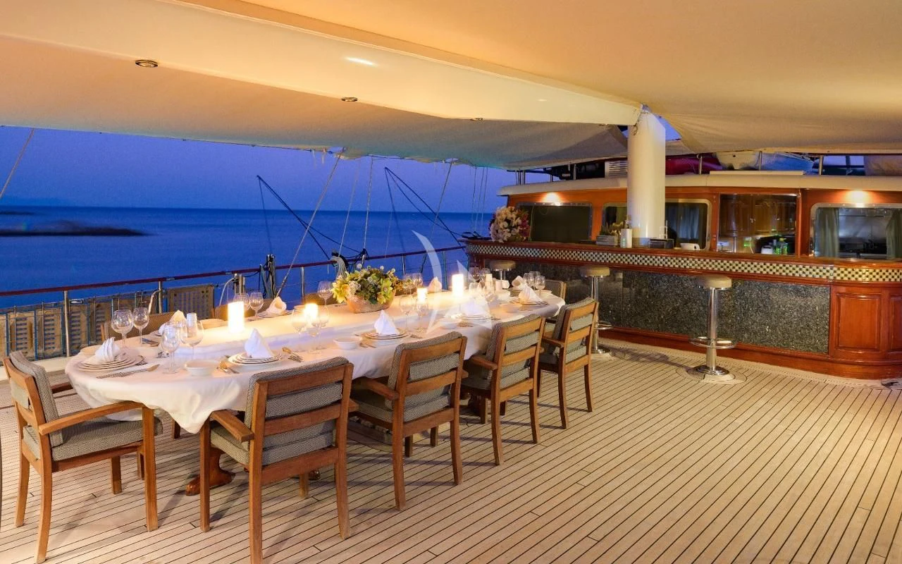 a restaurant with a table and chairs aboard KAPTAN KADIR Yacht for Sale