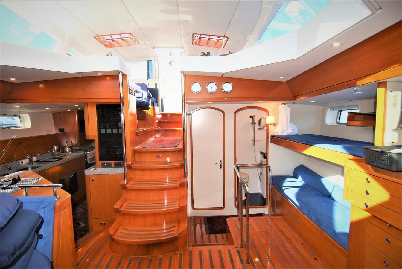 a room with a table and chairs aboard LEONORE Yacht for Sale