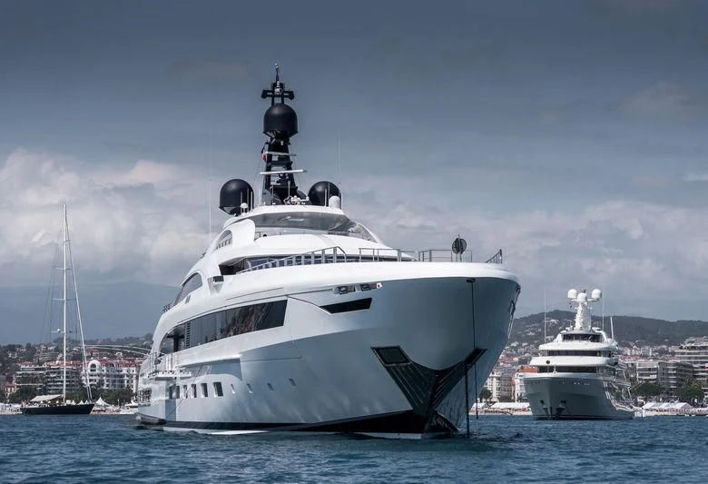 a large white boat in the water aboard YALLA Yacht for Sale