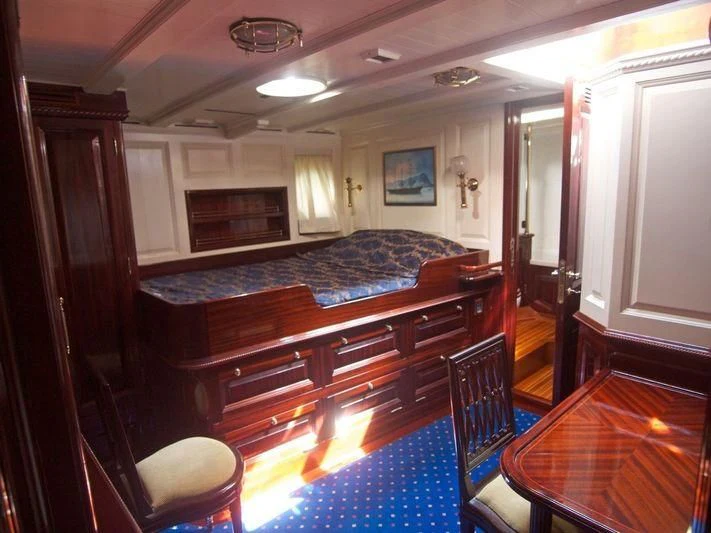 a bedroom with a large bed aboard DORIANA Yacht for Sale