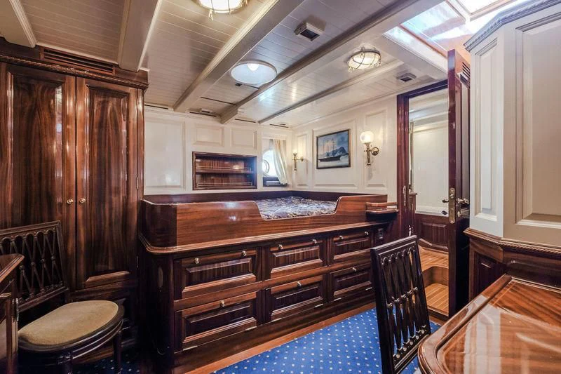 a large wooden cabinet in a room aboard DORIANA Yacht for Sale