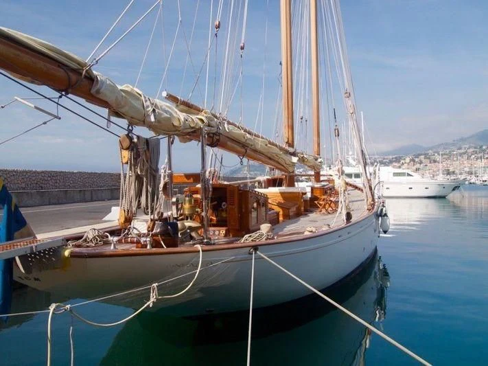 a sailboat docked at a pier aboard DORIANA Yacht for Sale