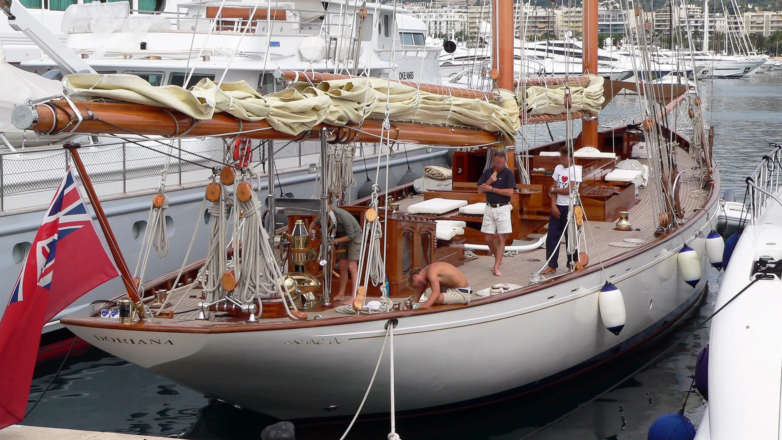 a boat with a flag on the front aboard DORIANA Yacht for Sale