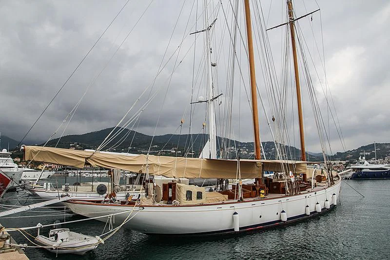 a large sailboat in a harbor aboard DORIANA Yacht for Sale