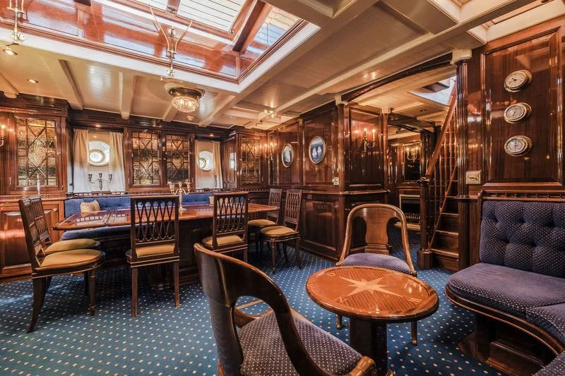 a large room with chairs and tables aboard DORIANA Yacht for Sale
