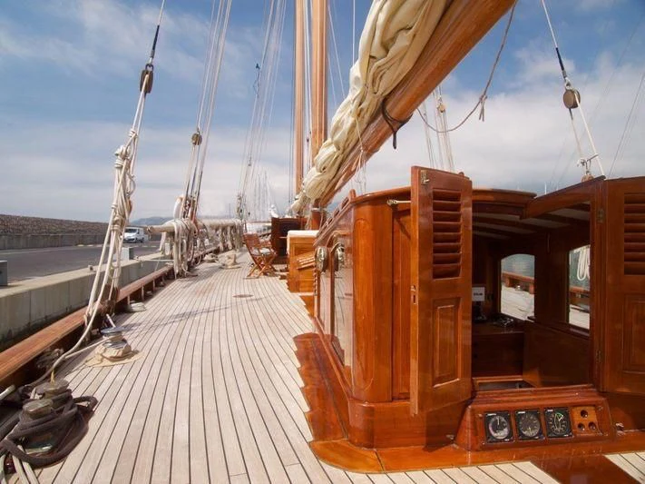 a wooden boat on a dock aboard DORIANA Yacht for Sale