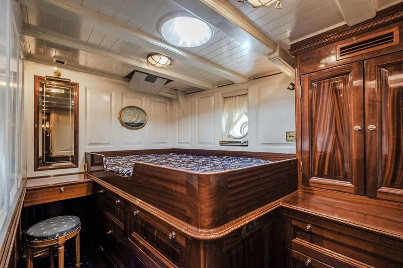 a large bedroom with a bed aboard DORIANA Yacht for Sale