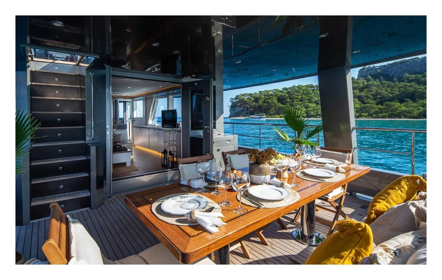 a dining table in a living room aboard BERING 70 RA Yacht for Sale