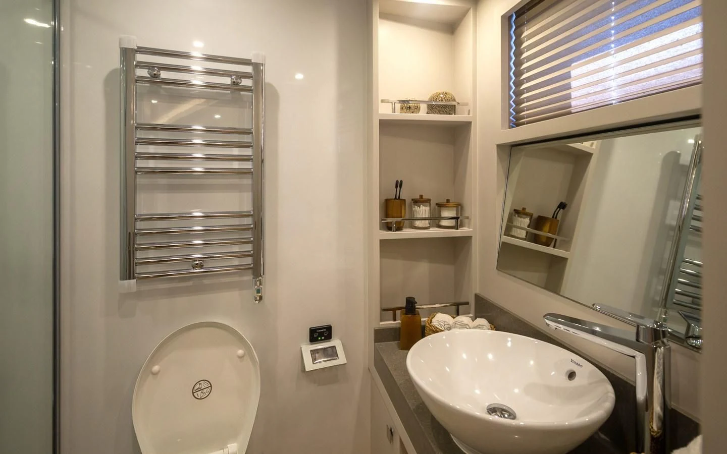 a bathroom with a sink and a mirror aboard BERING 70 RA Yacht for Sale