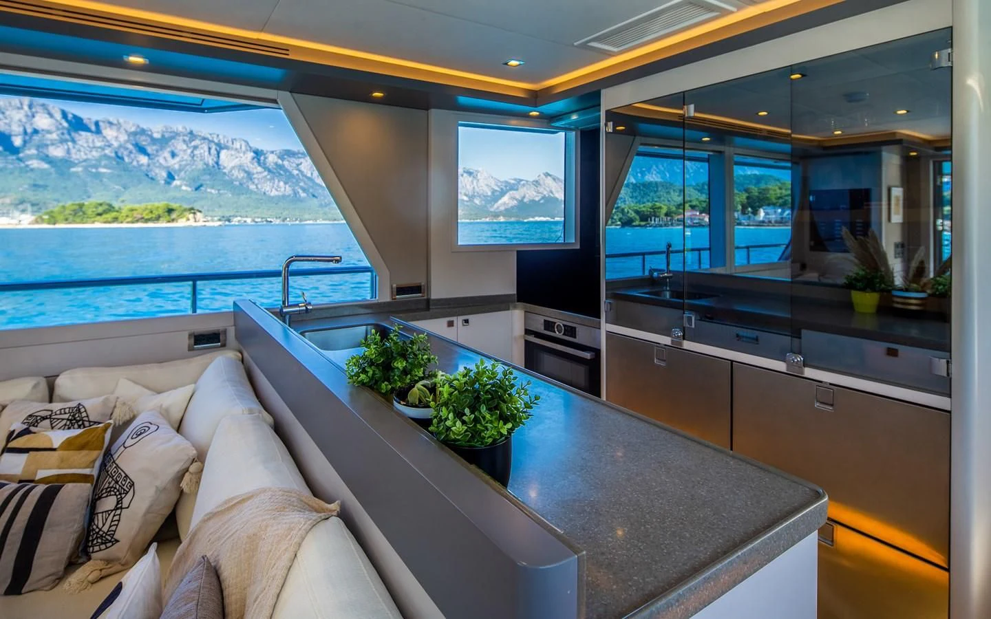 a kitchen with a large window aboard BERING 70 RA Yacht for Sale