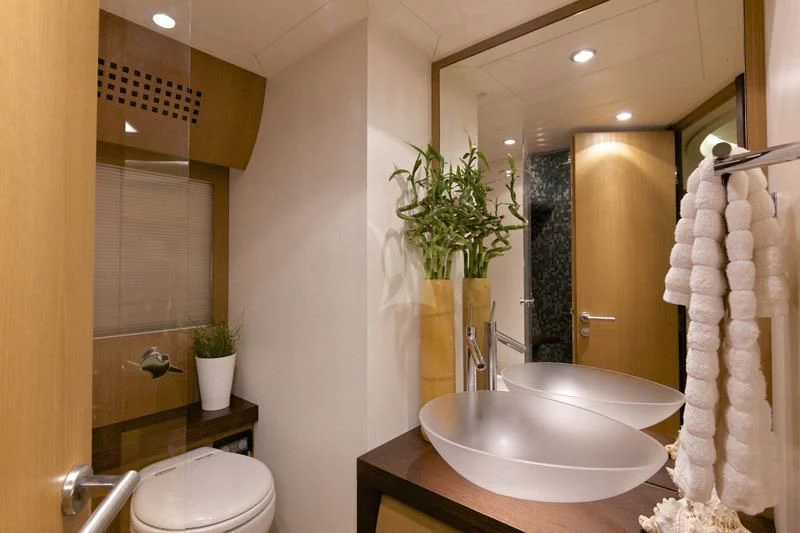 a bathroom with a sink and a mirror aboard SOLARIS Yacht for Sale