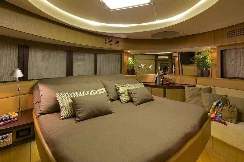 a large living room with a large couch and a large window aboard SOLARIS Yacht for Sale