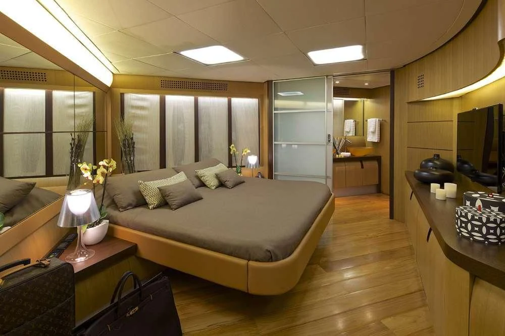 a large bedroom with a large bed aboard SOLARIS Yacht for Sale
