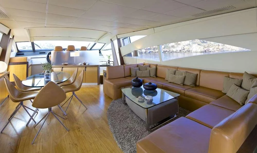 a living room with a couch and a table aboard SOLARIS Yacht for Sale