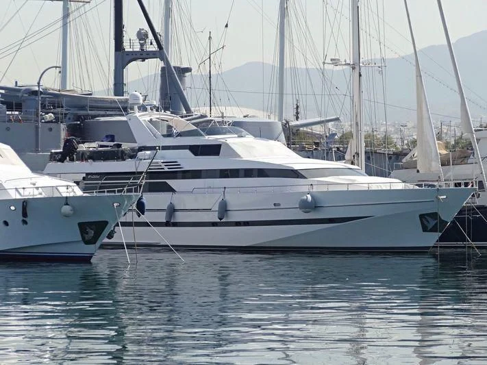 several white yachts in a harbor aboard HARAMA II Yacht for Sale