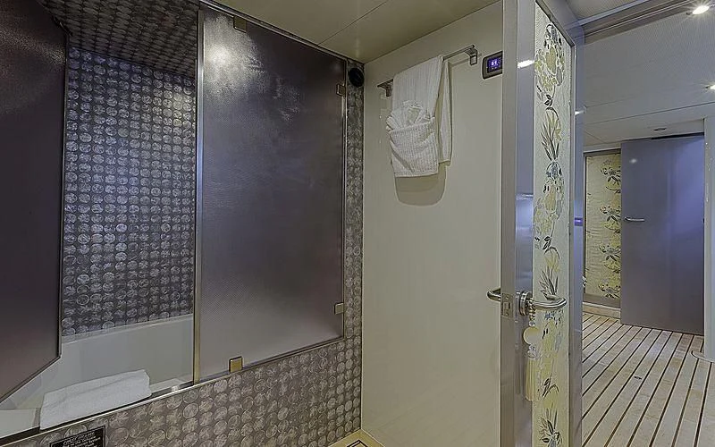 a bathroom with a shower curtain aboard FIRST HOME Yacht for Sale