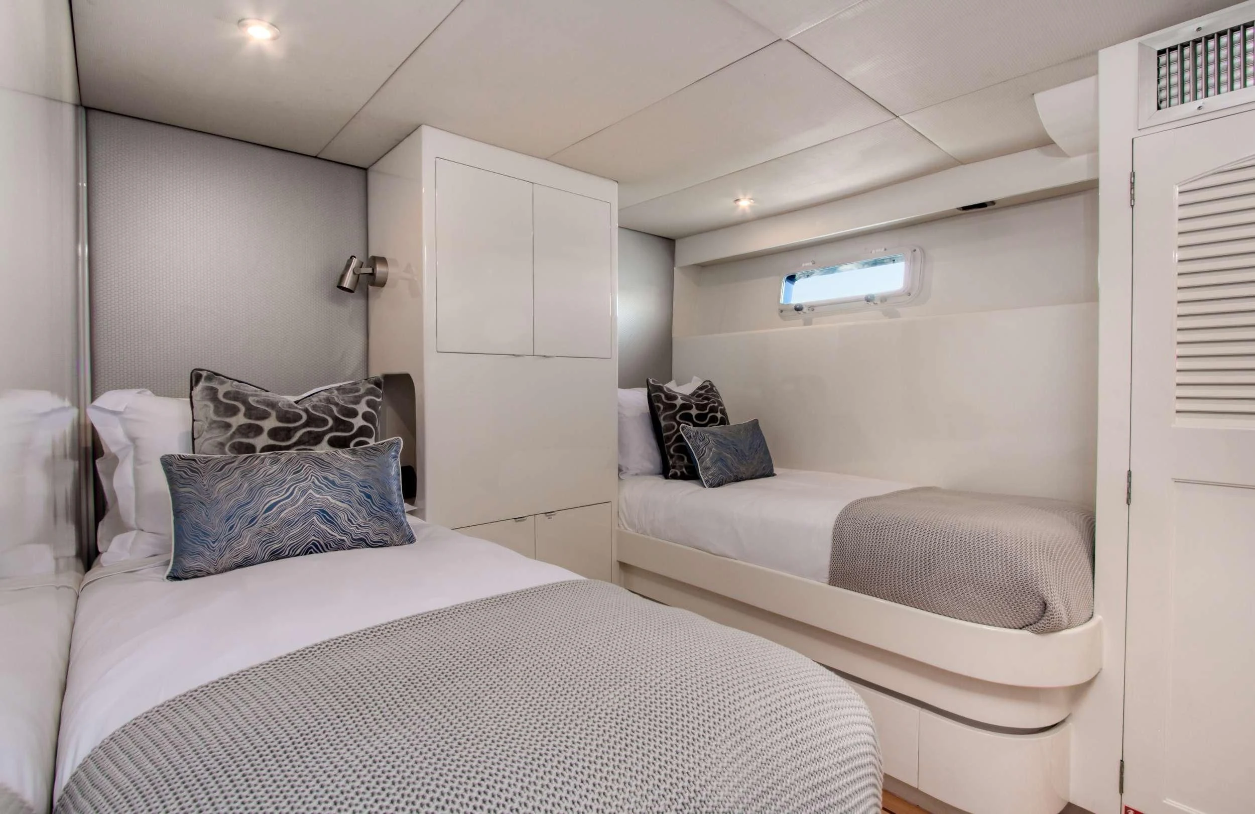 a room with two beds aboard FIRST HOME Yacht for Sale