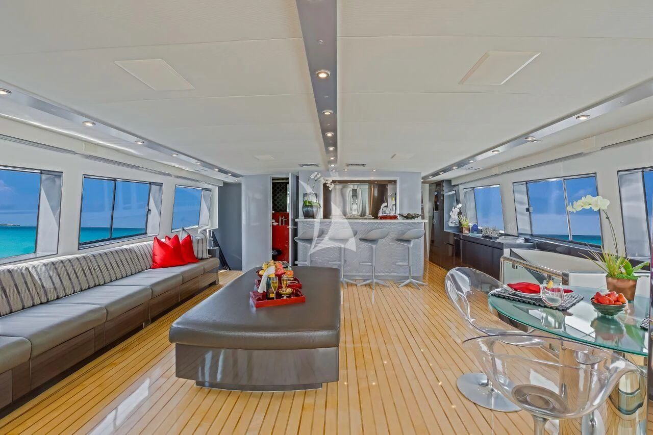 a living room with a large window aboard FIRST HOME Yacht for Sale