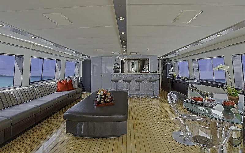 a living room with a large window aboard FIRST HOME Yacht for Sale