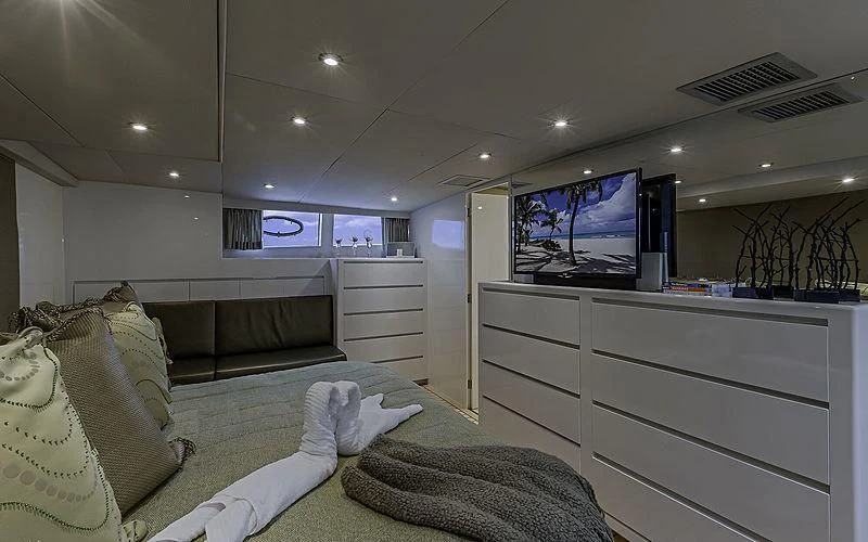 a room with a bed and a tv aboard FIRST HOME Yacht for Sale