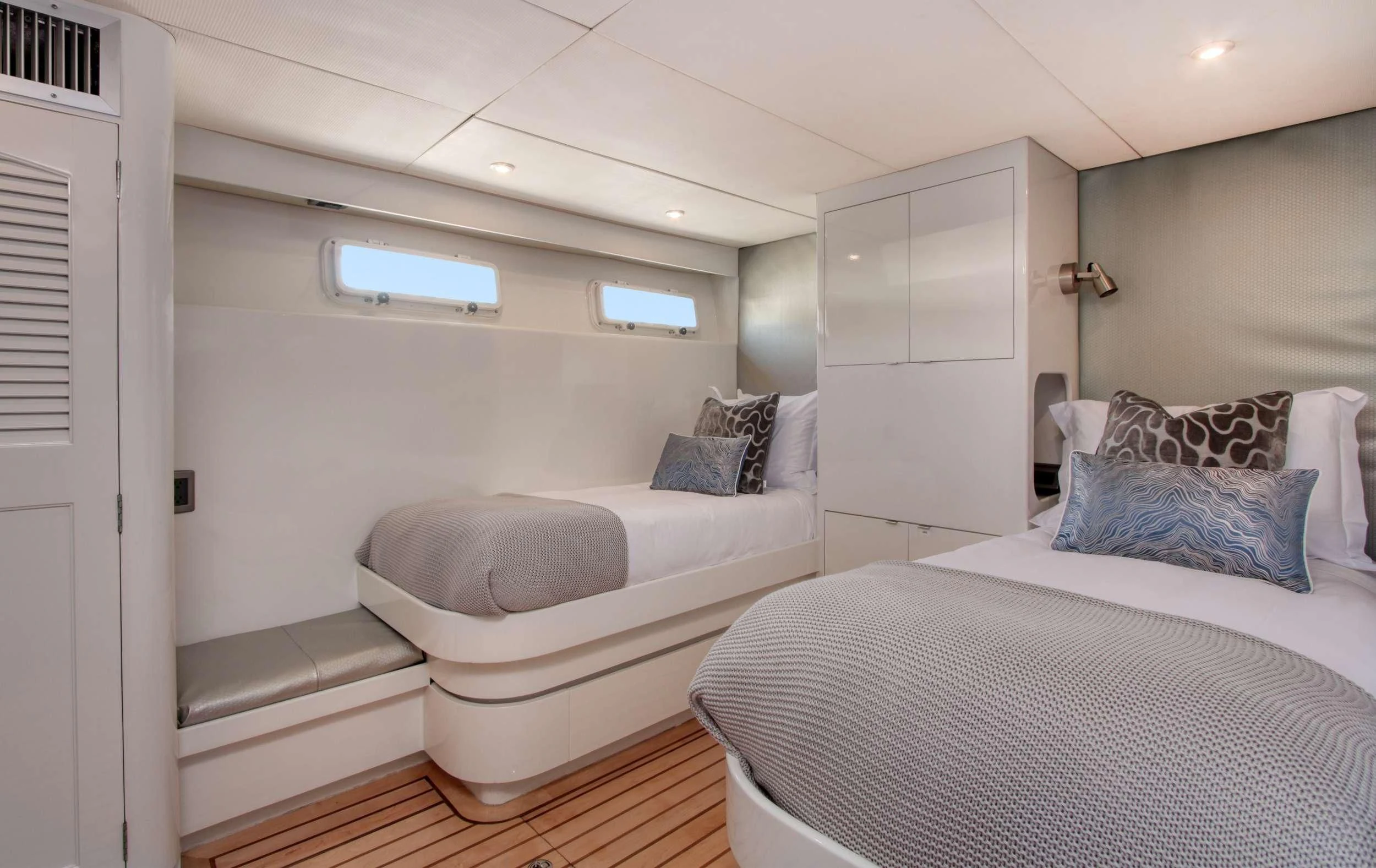 a room with two beds aboard FIRST HOME Yacht for Sale