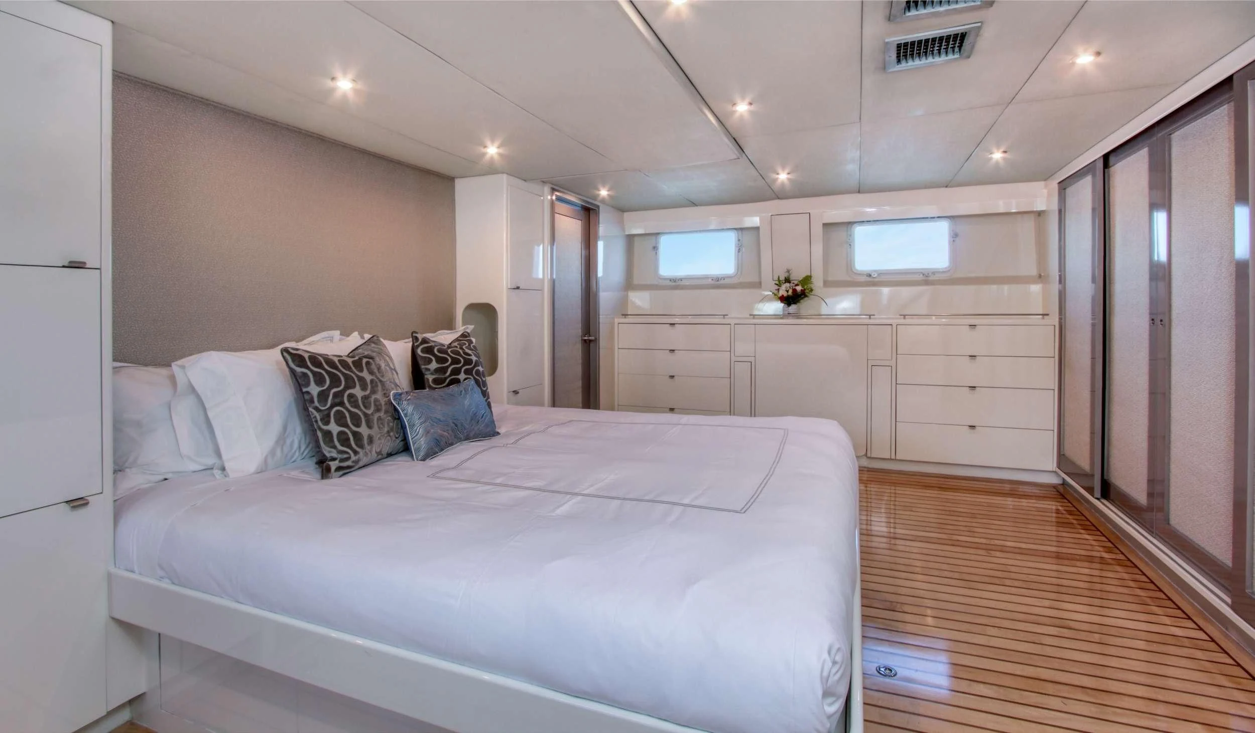 a large white bed in a room aboard FIRST HOME Yacht for Sale