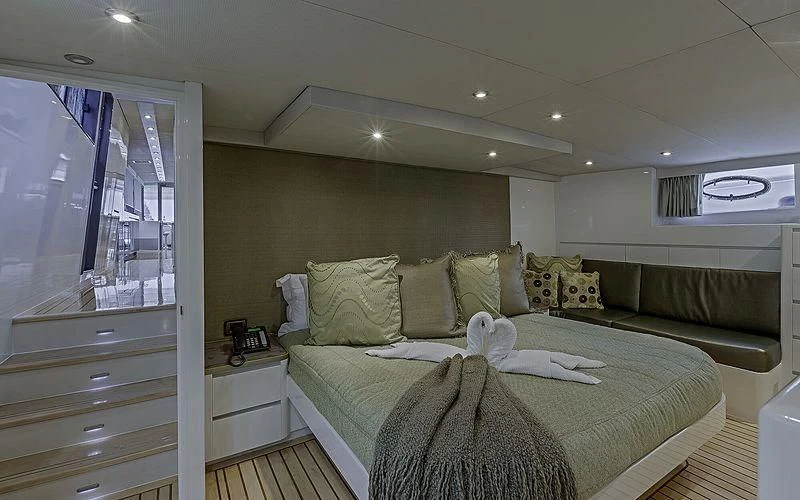 a large bed in a room aboard FIRST HOME Yacht for Sale