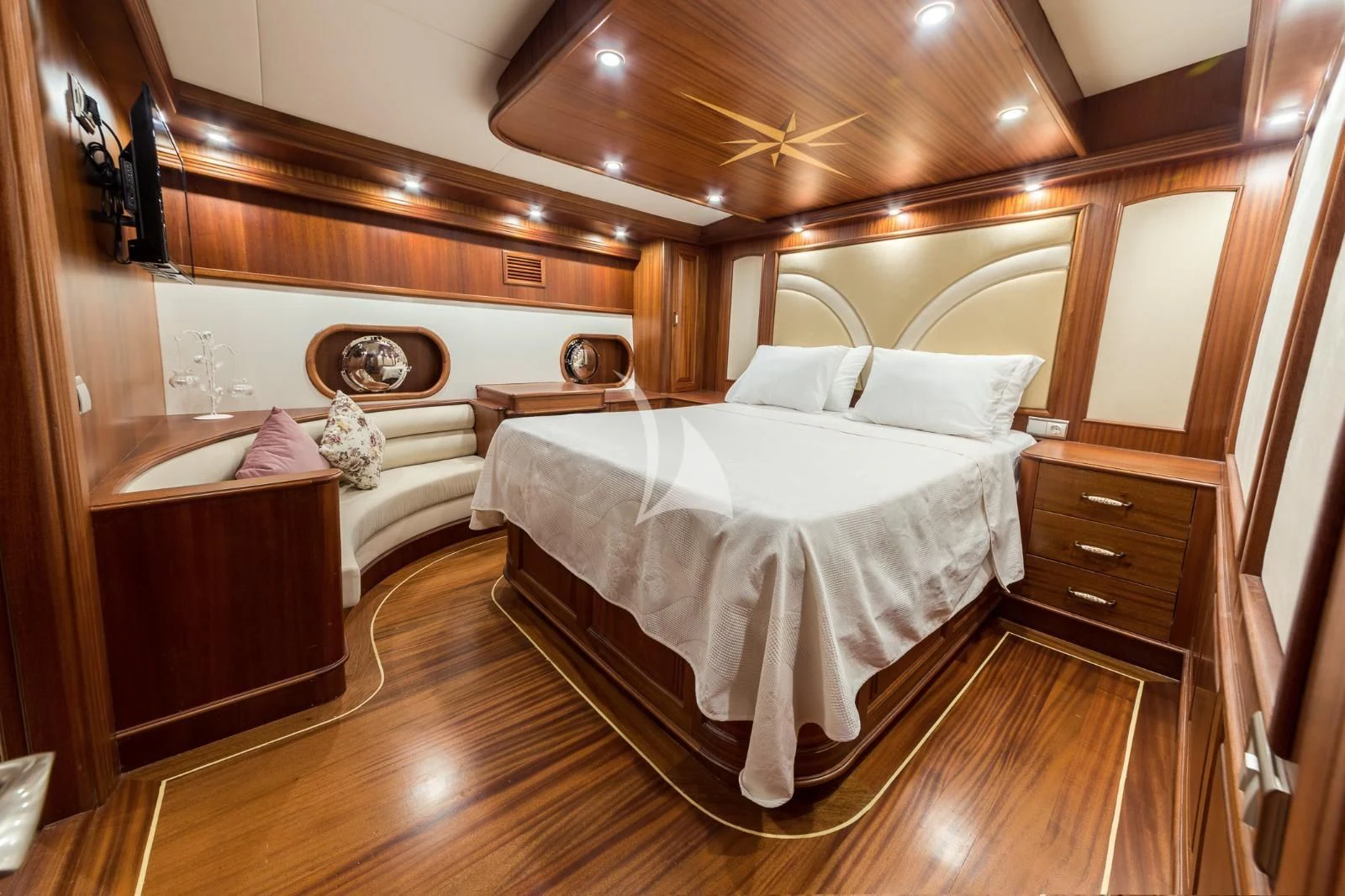 a room with a bed and a dresser aboard HALCON DEL MAR Yacht for Sale