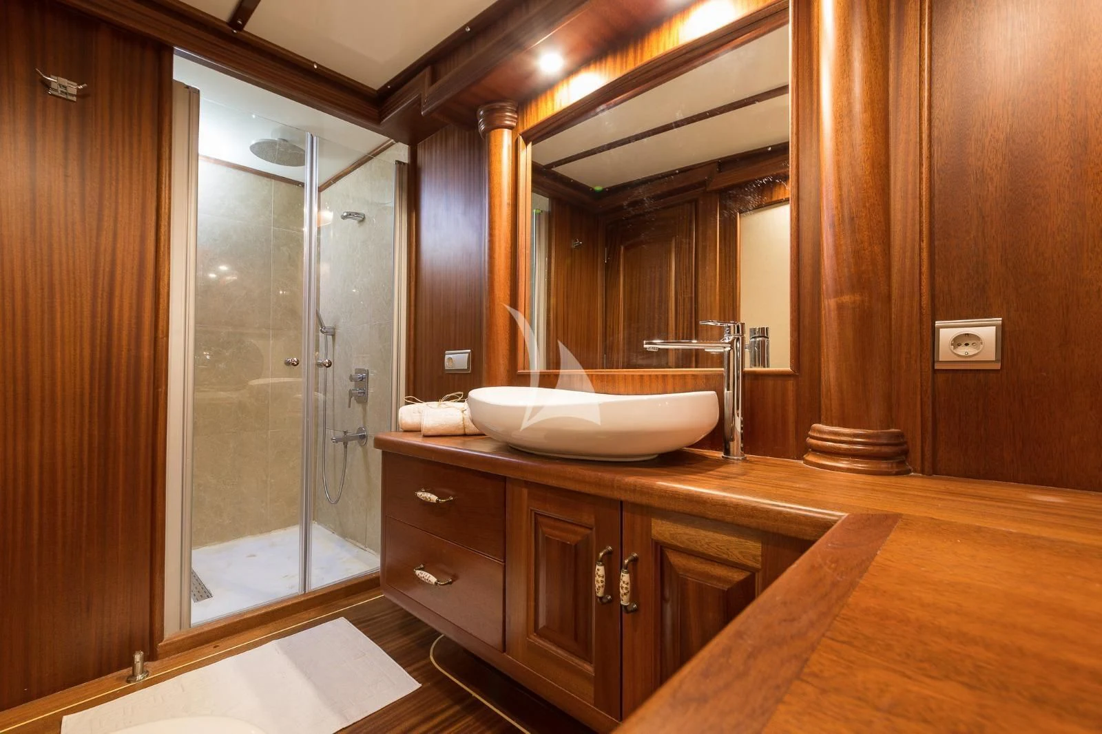 a bathroom with a sink and a shower aboard HALCON DEL MAR Yacht for Sale