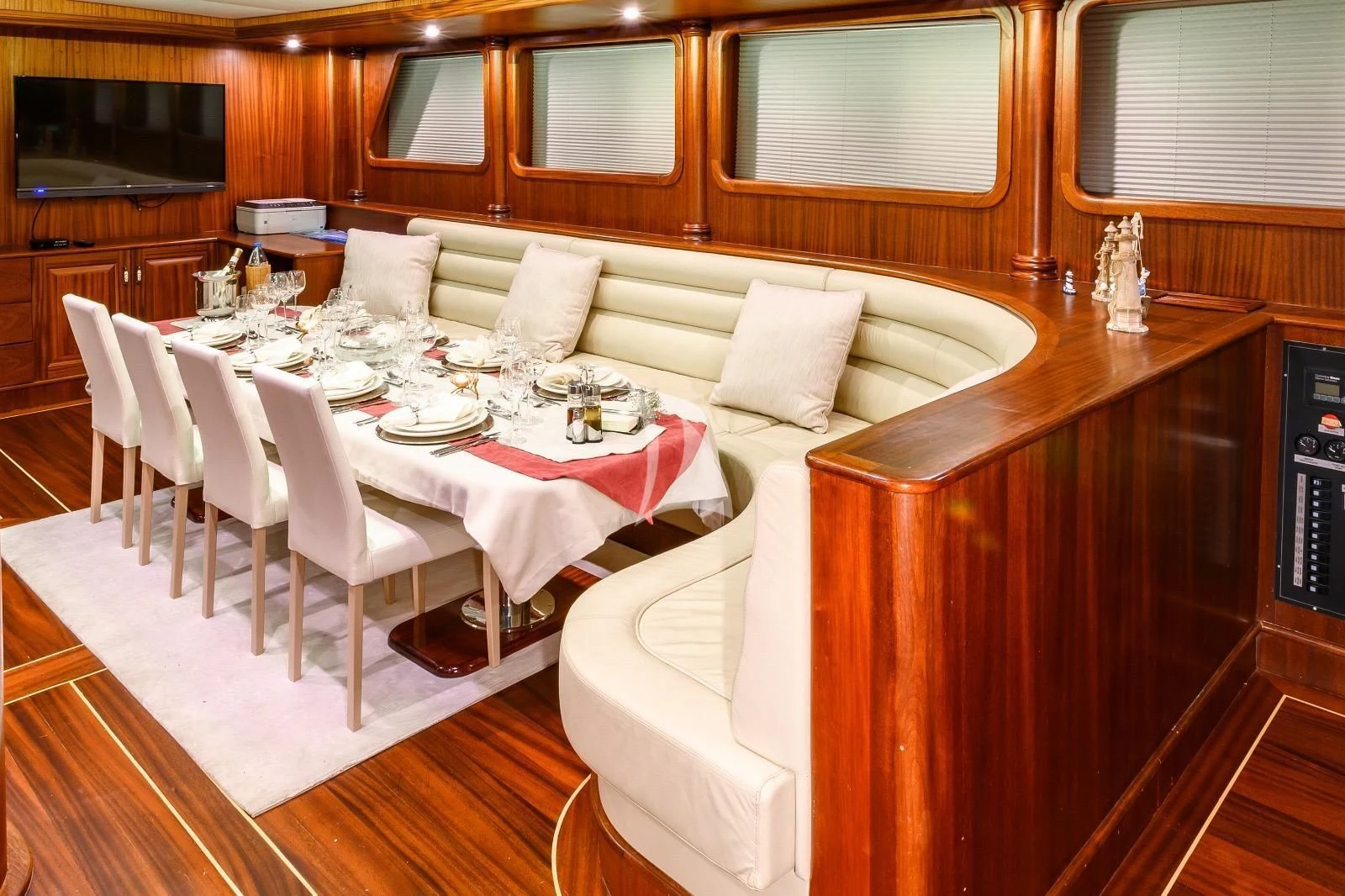 a room with a table and chairs aboard HALCON DEL MAR Yacht for Sale