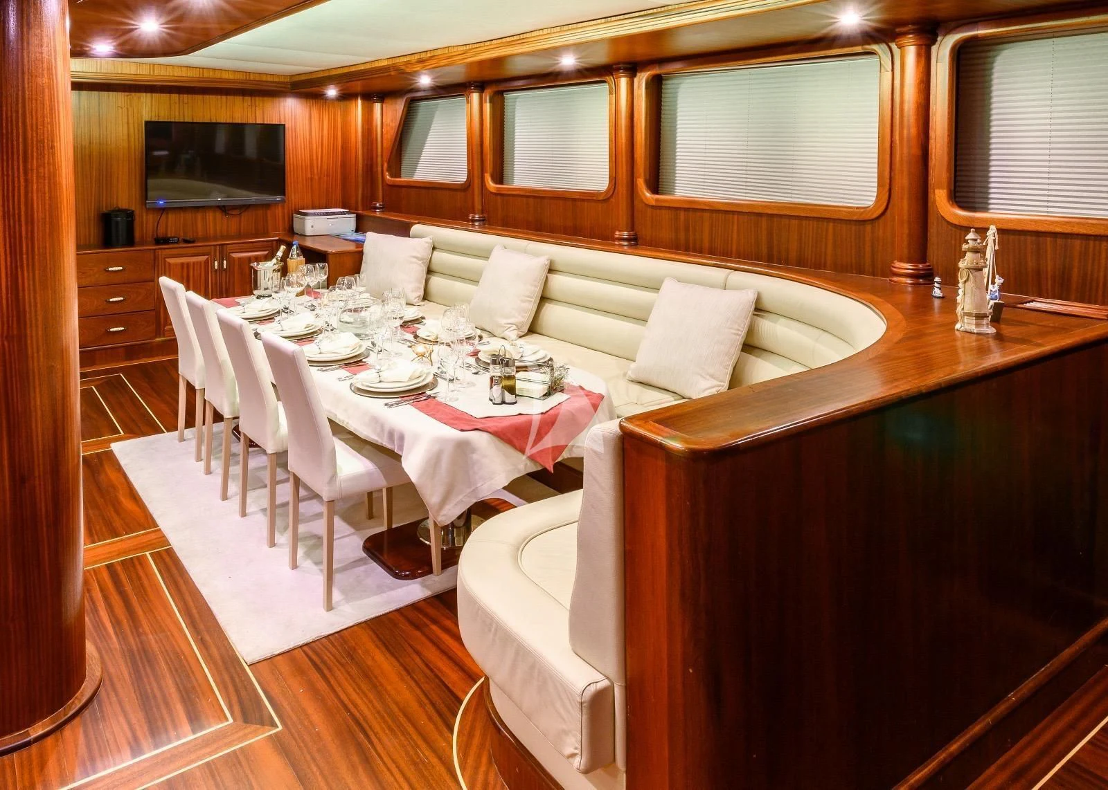 a room with a table and chairs aboard HALCON DEL MAR Yacht for Sale