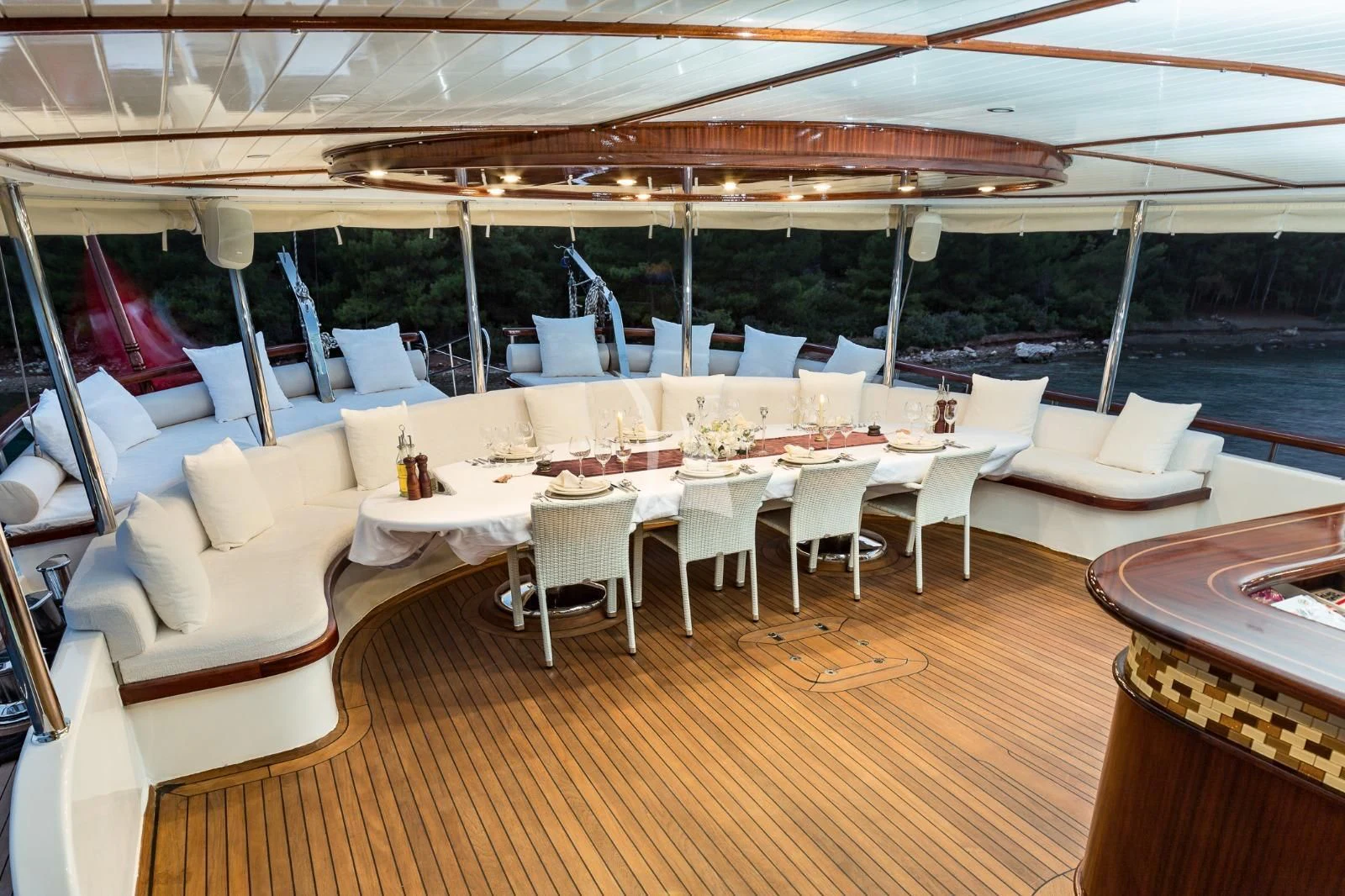 a room with tables and chairs aboard HALCON DEL MAR Yacht for Sale