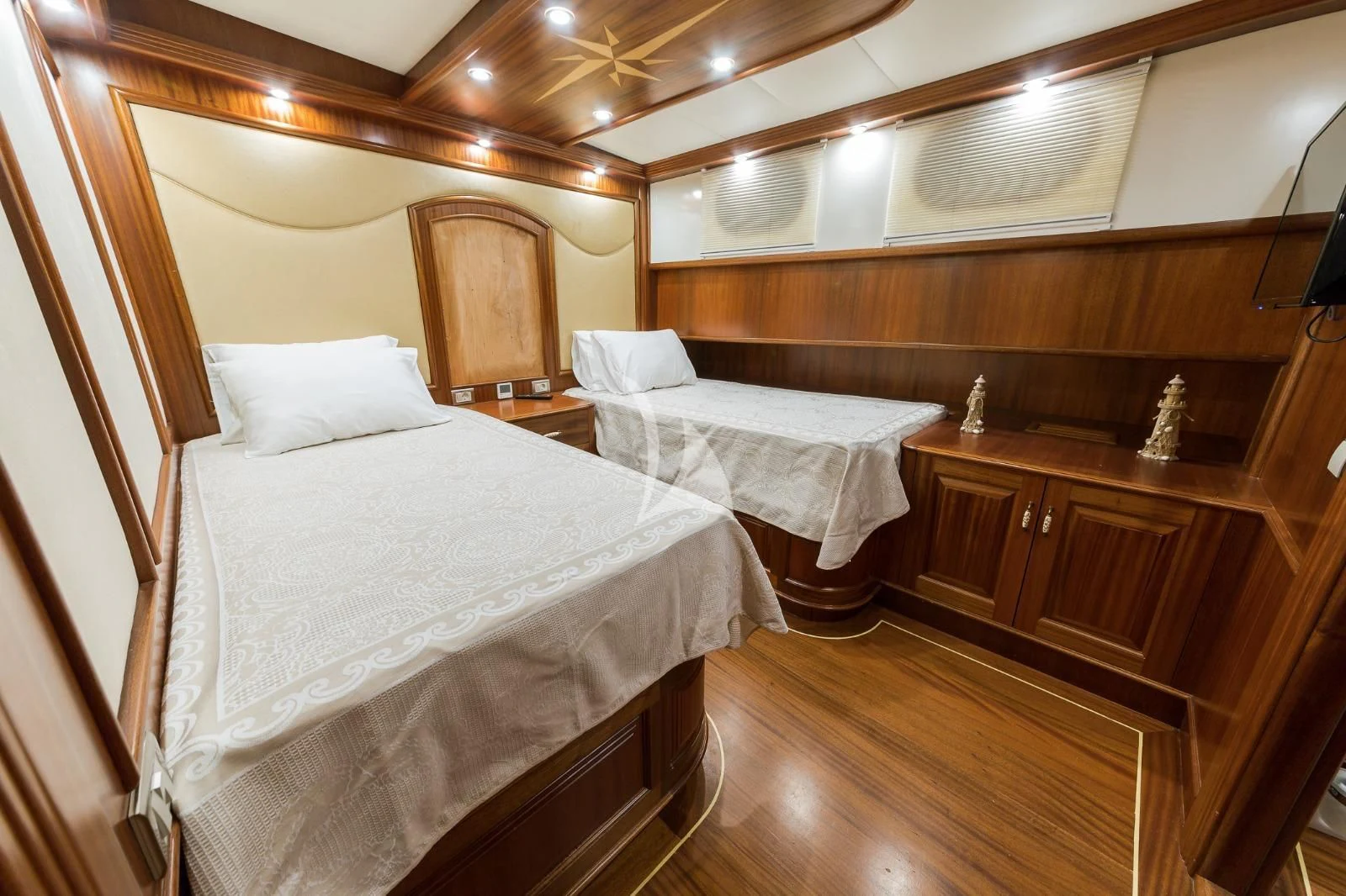 a room with wooden furniture aboard HALCON DEL MAR Yacht for Sale