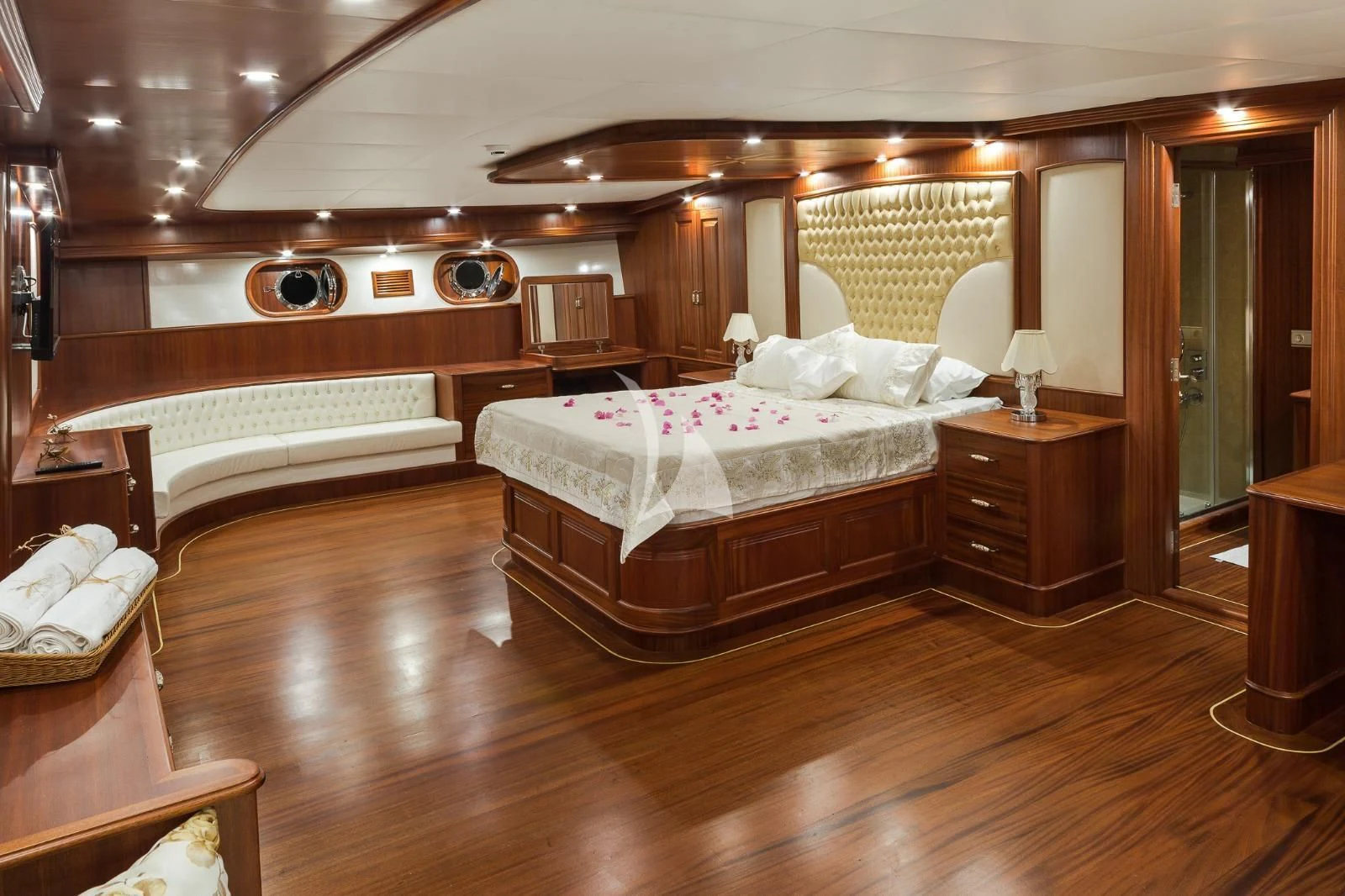 a room with a bed and a dresser aboard HALCON DEL MAR Yacht for Sale