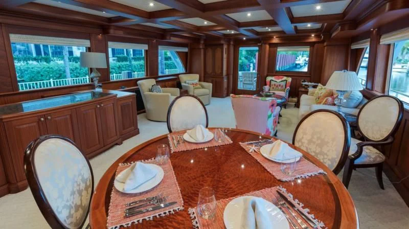 a dining room with a table set aboard ANNDRIANNA Yacht for Sale
