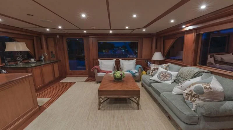 a living room with a couch and a coffee table aboard ANNDRIANNA Yacht for Sale