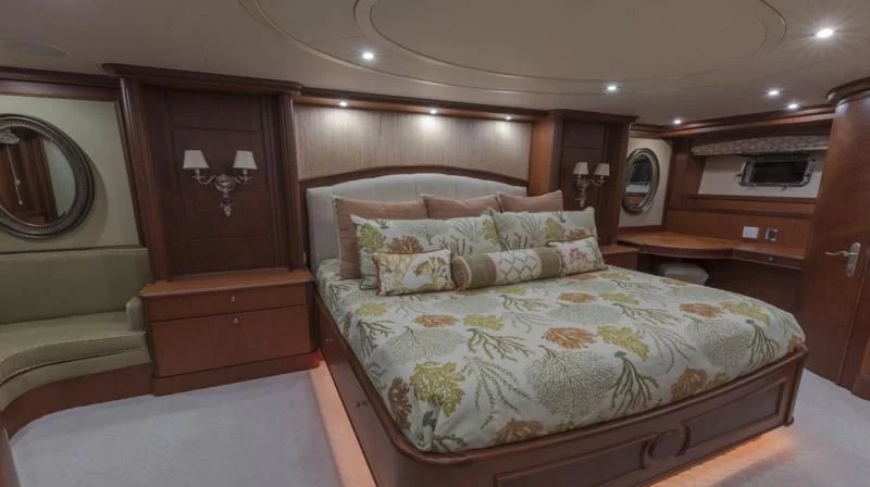 a bed with a mirror above it aboard ANNDRIANNA Yacht for Sale
