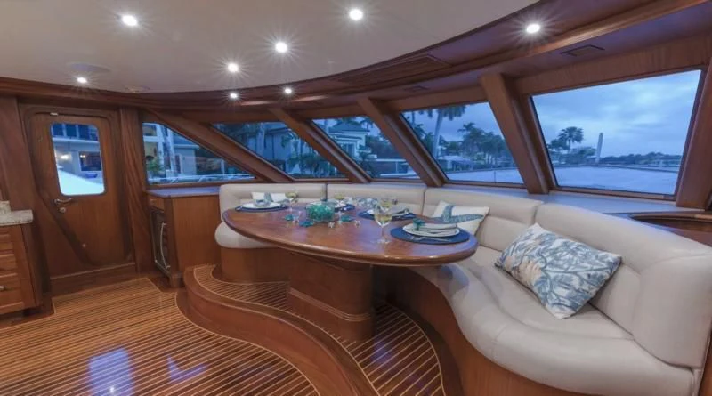 a living room with a table and couches aboard ANNDRIANNA Yacht for Sale