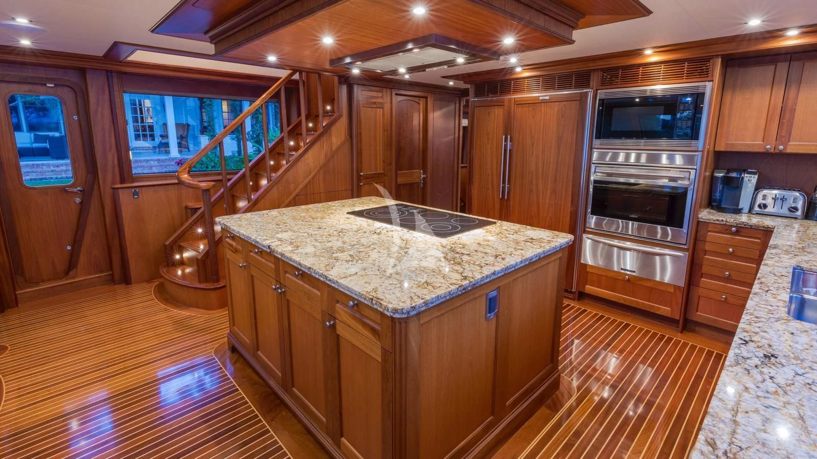 a kitchen with a marble counter top aboard ANNDRIANNA Yacht for Sale