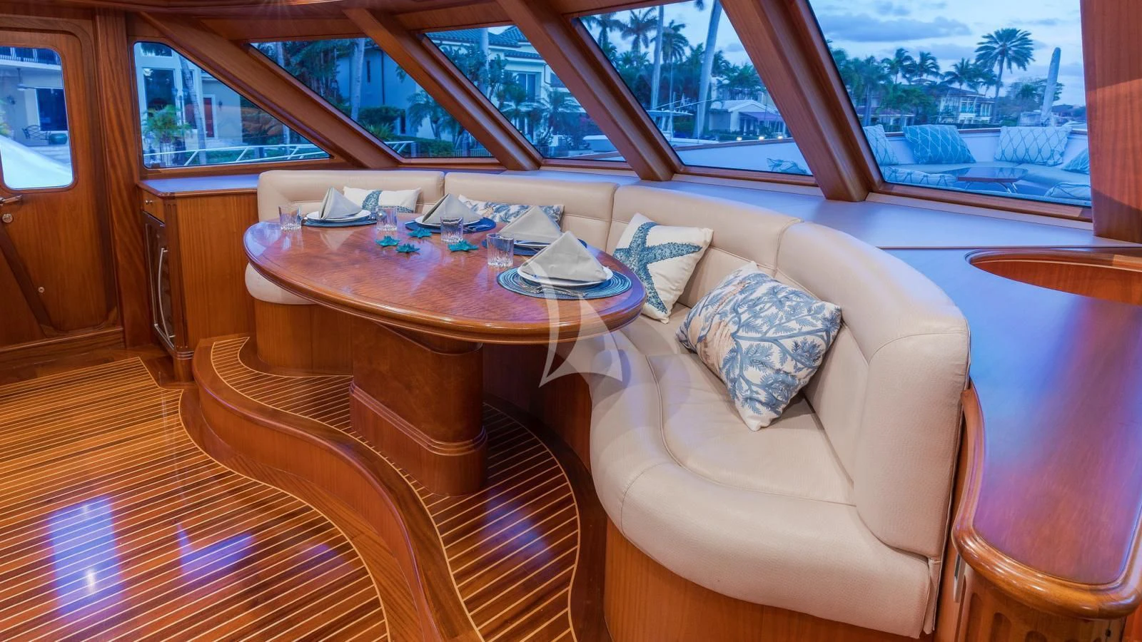 a table and couch in a room aboard ANNDRIANNA Yacht for Sale